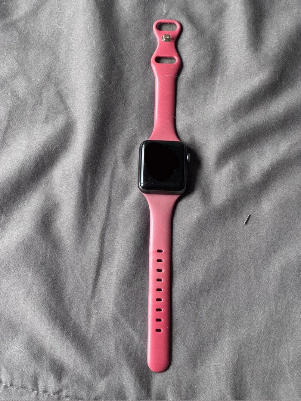 Apple Watch Series 3 with red silicone band